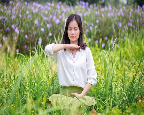 Woman breathing fresh air in nature